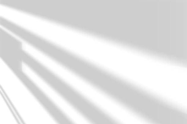 istock Abstract shadow and striped diagonal light background on white wall from window, 1419934508