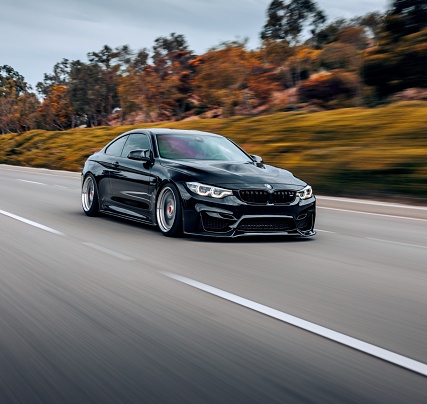 Seattle, WA, USA\nSeptember 1, 2022\nBlack BMW M4 driving on the street without any other cars around