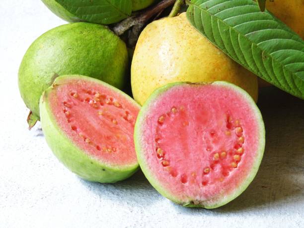 istock Guava with stalks and leaves on the table 1419938578
