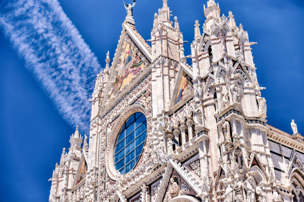 The bell tower and Duomo di siena in Siena Italy