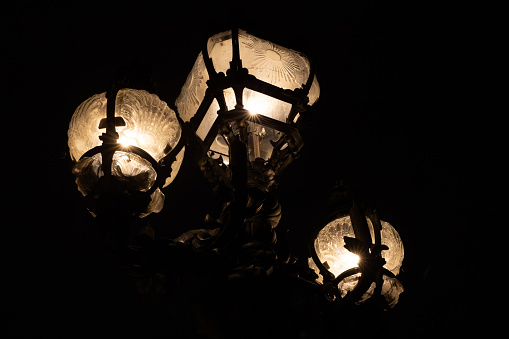 Close up view of the lit carved glass bulbs