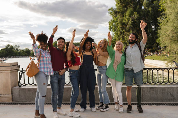 Happy friends from various cultures and races taking selfie youth and friendship with young people having fun together, millennial generation Happy friends from various cultures and races taking selfie youth and friendship with young people having fun together, millennial generation organised group photo stock pictures, royalty-free photos & images