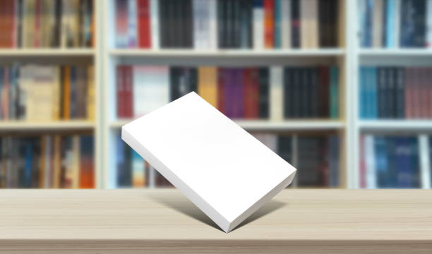 book standing horizontally in front of library background, close up