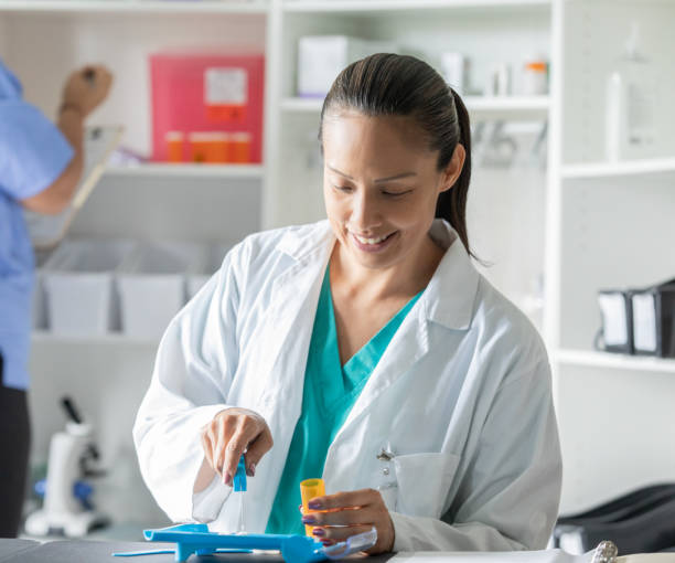 istock Mature pharmacist sorts medication and counts pills while fulfilling prescription medication for customer 1419944582