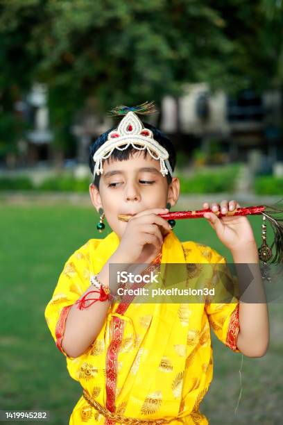 Little Krishna Portrait With Flute Outdoor In Park Stock Photo - Download Image Now - Child, 4-5 Years, Acting - Performance