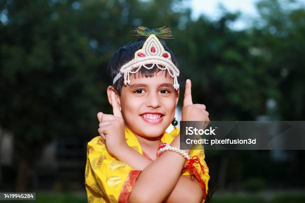 Little Krishna With Toothy Smile Portrait Outdoor In Nature Stock Photo - Download Image Now
