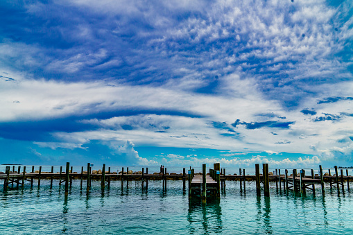 Wooden pier in calm blue wayer