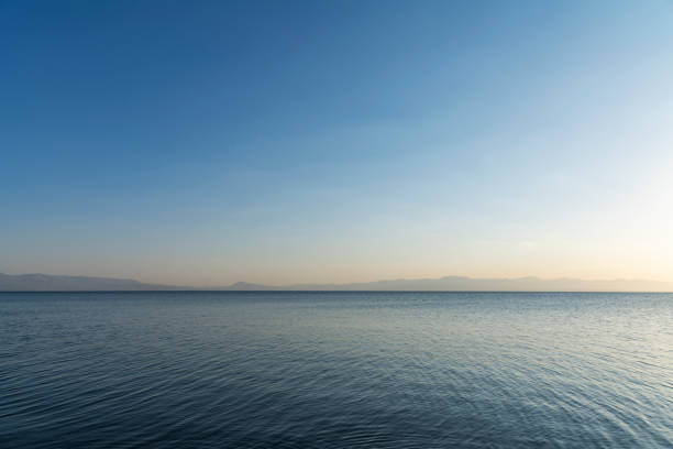 Water landscape. Beautiful lake under blue sky with clouds.
