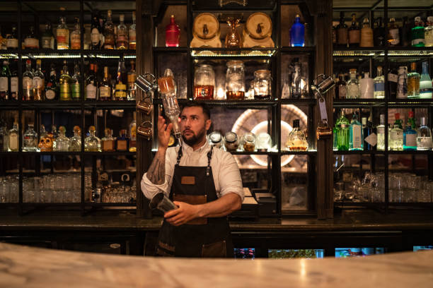 istock Bartender is focused while preparing alcoholic cocktails in a night club 1419947989