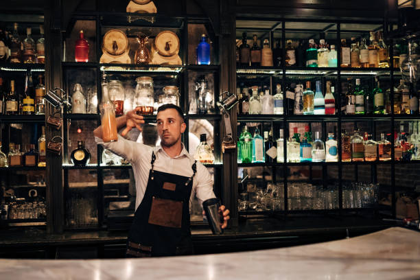 istock A millennial man working in a nightclub makes refreshing alcoholic cocktails 1419948758