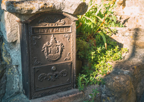 istock Old mailbox in an old french town. Vintage. Antique mailbox 1419948816