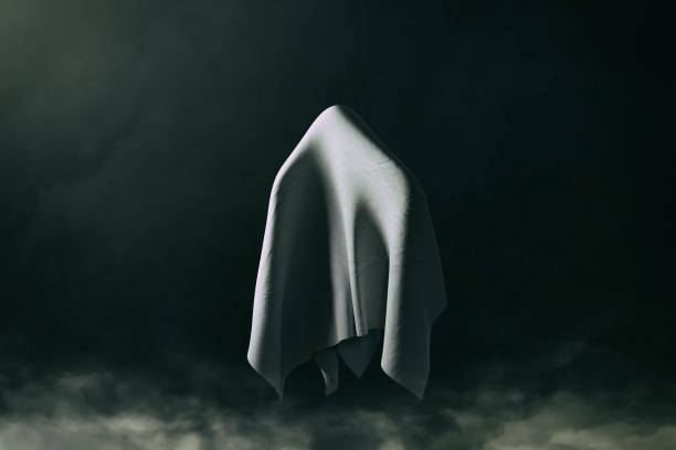 istock Halloween Ghost on Black Background and Smoke 1419951316