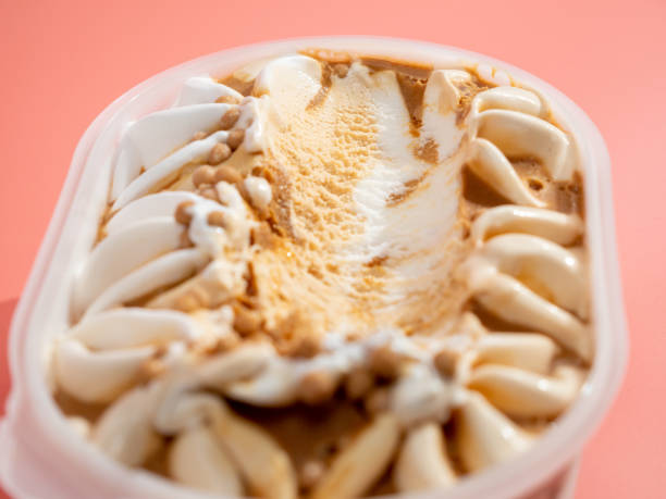 istock Caramel ice cream on a pink background. 1419957384