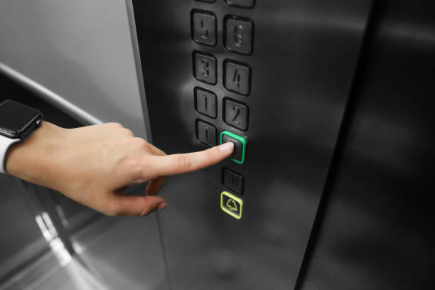 istock girl chooses the floor in the elevator 1419957496