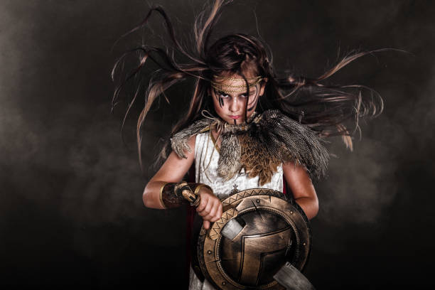 Little girl wearing a gladiator halloween costume