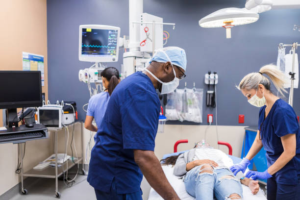 istock Diverse ER team works smoothly to care for female patient 1419962932