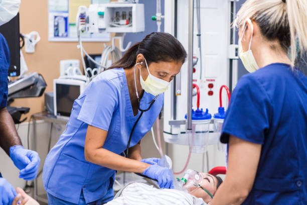 istock Diverse medical professionals work on female patient in ER 1419962966
