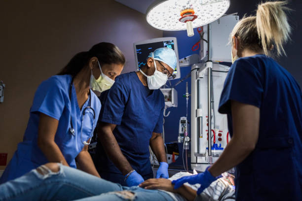 istock In darkened exam room, ER team stabilizes female patient 1419962974