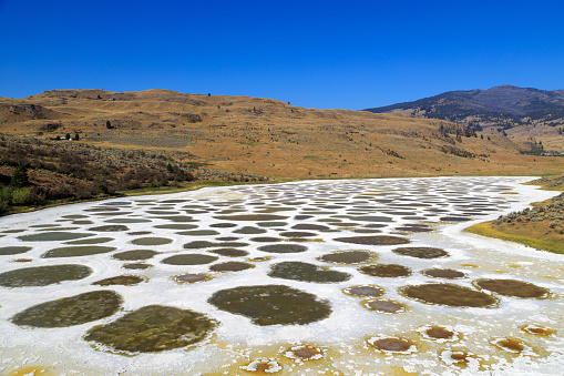Spotted Lake is a saline endorheic alkali lake located northwest of Osoyoos in the eastern Similkameen Valley of British Columbia, Canada,