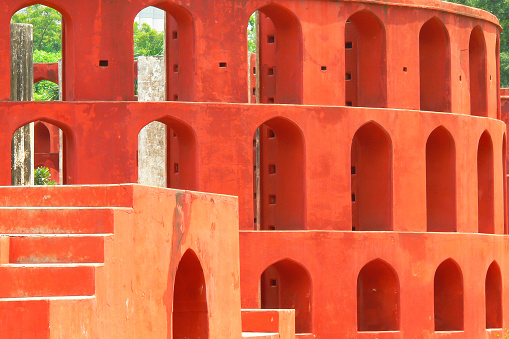 Beautiful, colorful, eyecatching architecture at historic Jantar Mantar astronomical observatory, Delhi, India built by Maharaja Jaisingh centuries ago. A UNESCO Heritage site.
