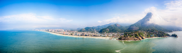 The coastilne,  the hills and some houses at Barra da Tijuca beach in a sunny day