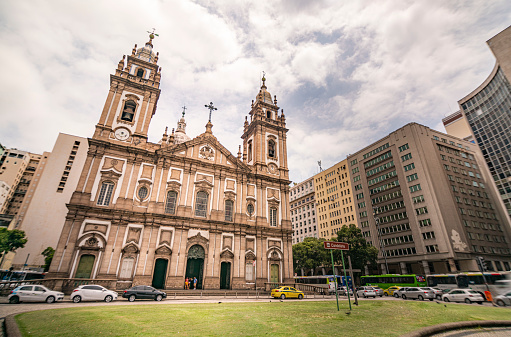 The facade of church located in  Rio de Janeiro downtown around a lot of buildings