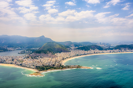 View from Copacabana beach to Ipanema beach separated by the Copacabana Fort and Arpoador in a sunny day