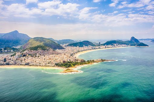 View from Copacabana beach to Ipanema beach separated by the Copacabana Fort and Arpoador in a sunny day