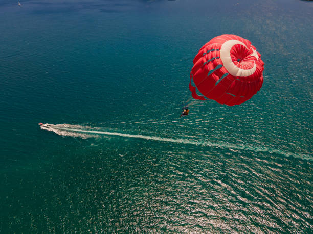 istock Parasailing photo with the Turkish flag pattern taken with a drone. 1419970113