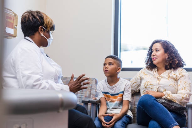 istock Pediatrician talks to family 1419970657