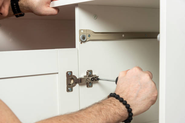 istock a male furniture assembler is engaged in assembling a desk with a bedside table 1419977001