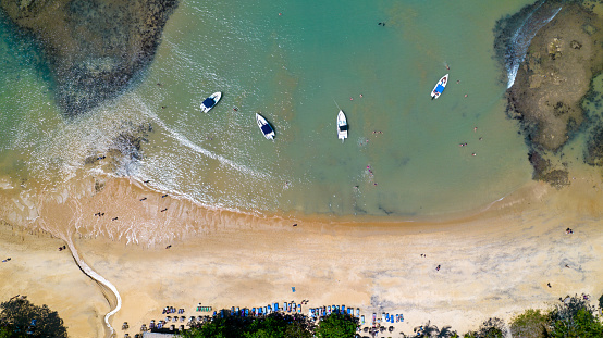 Aerial view of Praia do Espelho, Porto Seguro, Bahia, Brazil. Natural pools in the sea, cliffs and greenish water.