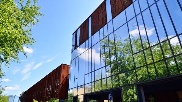 istock Architecture details. Modern glass building facade in sunny day. 1419983283