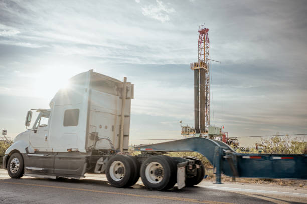 istock Dracking Drilling Rig Creating Gas or Oil Well Silhouetted at Dusk Under a Dramatic Sunset Sky 1419983288