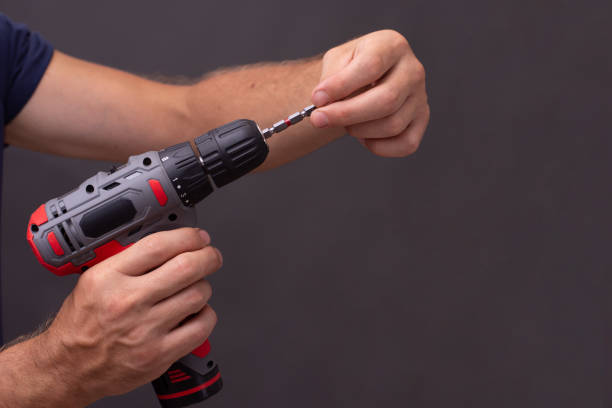 istock working on an electric screwdriver on a black background 1419984253