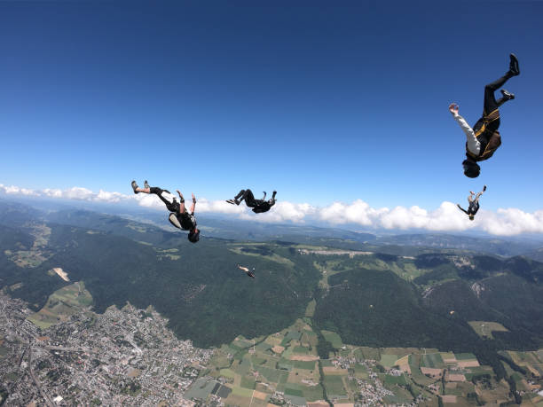 istock Skydivers fall upside down, over Swiss countryside 1419984836