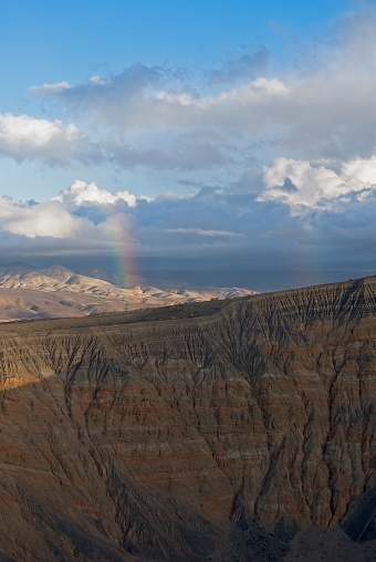 Double rainbow over Ubehebe Crater after rain showers in Death Valley National Park. Multi-hued caldera walls
