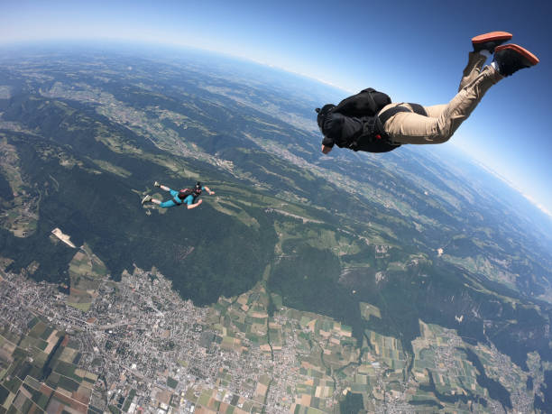 istock Skydivers fall over Swiss countryside, in aerial flight 1419984970
