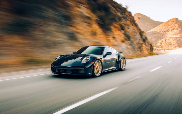 Porsche 911 Turbo S LA, CA, USA
8/12/2022
Porsche 911 Turbo S driving on the road with a rock wall next to the car sports car stock pictures, royalty-free photos & images