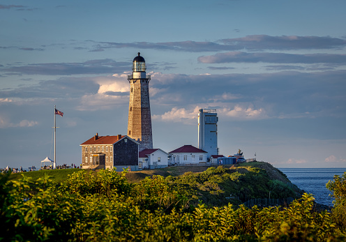 Montauk Point Lighthouse in evening sun.  Located in Montauk Point State Park, Montauk, Long Island, New York.