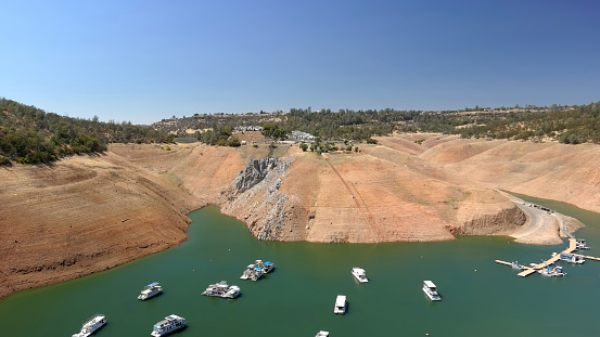 Lake Oroville Marina with houseboats. California's extreme drought has caused many of the houseboats to be removed from the lake to prevent stranding.