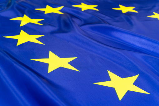 CLOSE-UP OF THE YELLOW STARS OF EUROPEAN UNION FLAG.