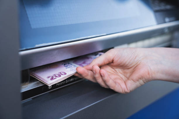 istock Withdraw cash from an ATM 1419993135