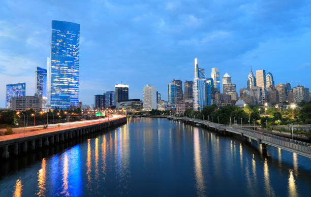 Philadelphia skyline reflected on Schuylkill River at dusk, Pennsylvania, USA