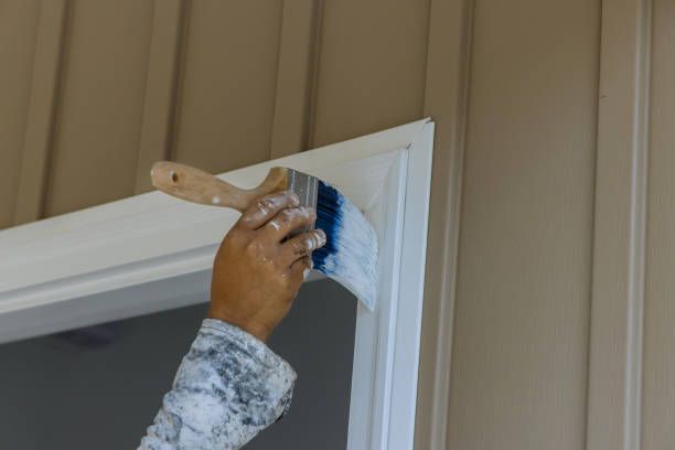 Painting wooden door trim stock photo