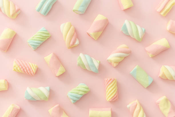Close-up of colorful peach ring gummies displayed in a Turkish bazaar, showing sugar-coated texture and vibrant colors.