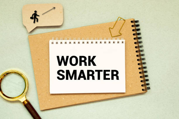 istock work smarter reminder on a green sticky note against rustic barn wood p productivity concept. 1419996103