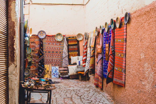 moroccan street with carpet weaving stock photo