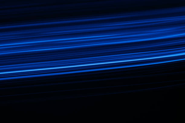 istock blur glowing lines neon light flare blue black 1420004539