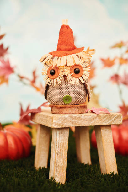 istock Cute fall arrangement with owl and pumpkins in bright setting for Thanksgiving 1420005319